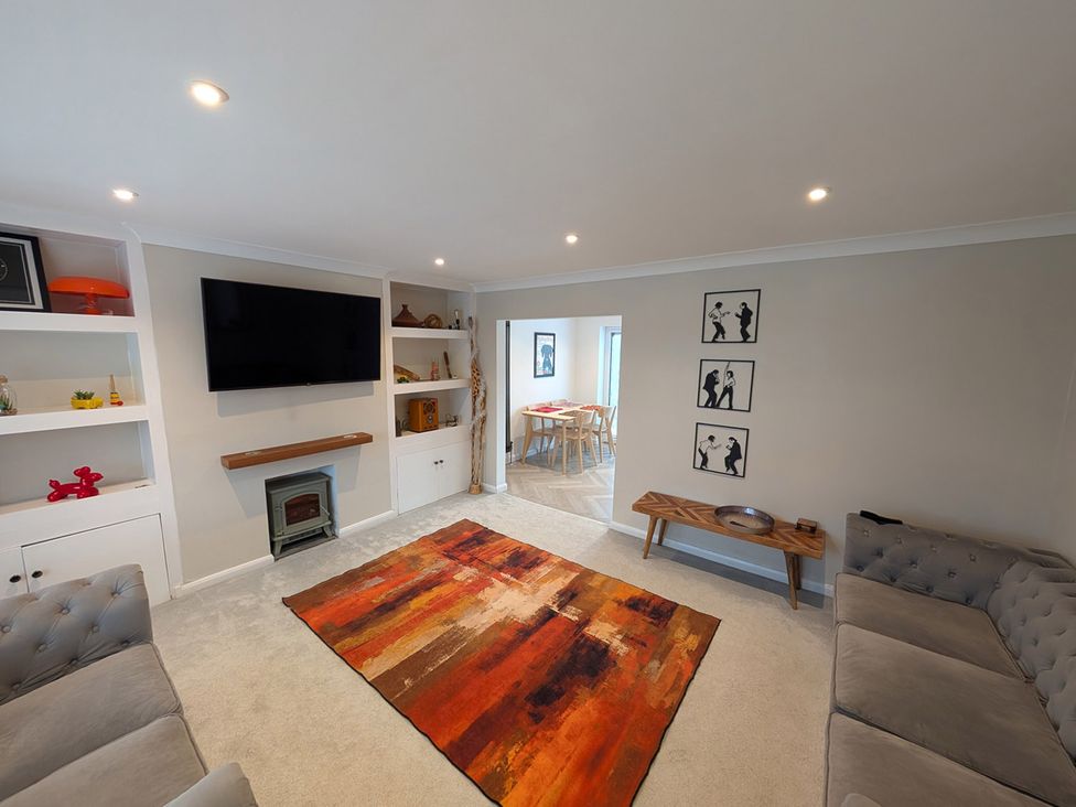 A living room with a television and sofa at 3 Bed Sleeps 5 Garden Parking Pets Carlisle