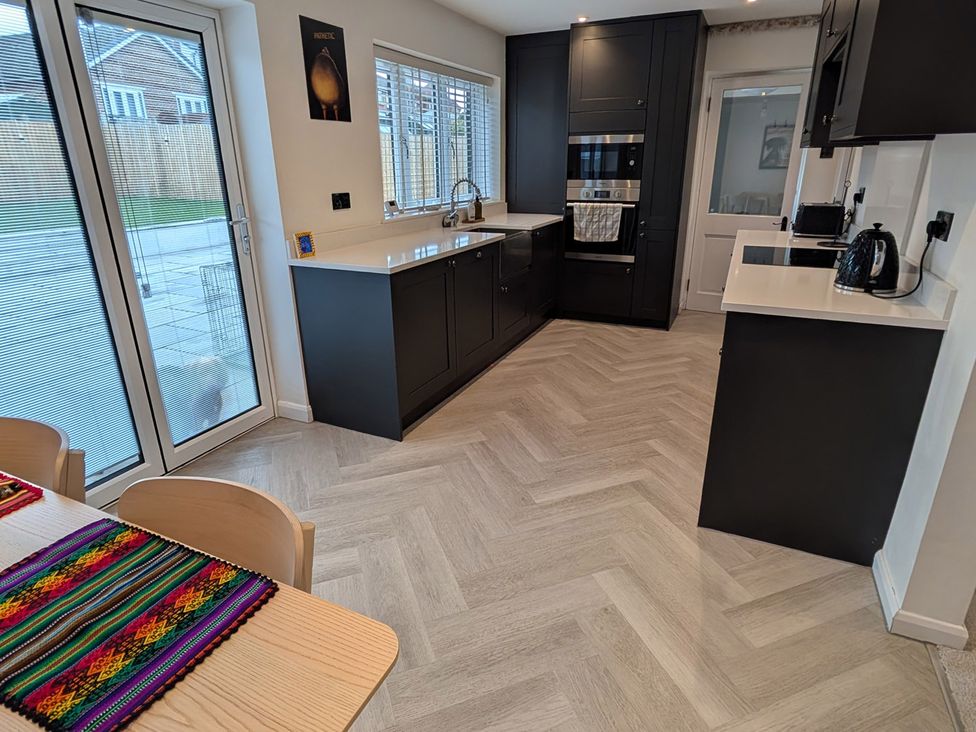 A kitchen with a sink and oven at 3 Bed Sleeps 5 Garden Parking Pets in Carlisle