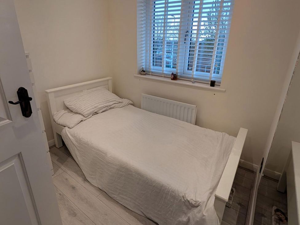 A bedroom with a bed and window at 3 Bed Sleeps 5 Garden Parking Pets in Carlisle