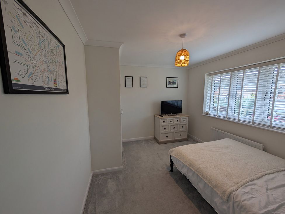 A bedroom with a bed and a television at 3 Bed Sleeps 5 Garden Parking Pets in Carlisle