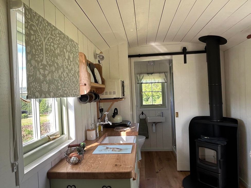 A kitchen with a stove and sink at The Old Barn in Manchester
