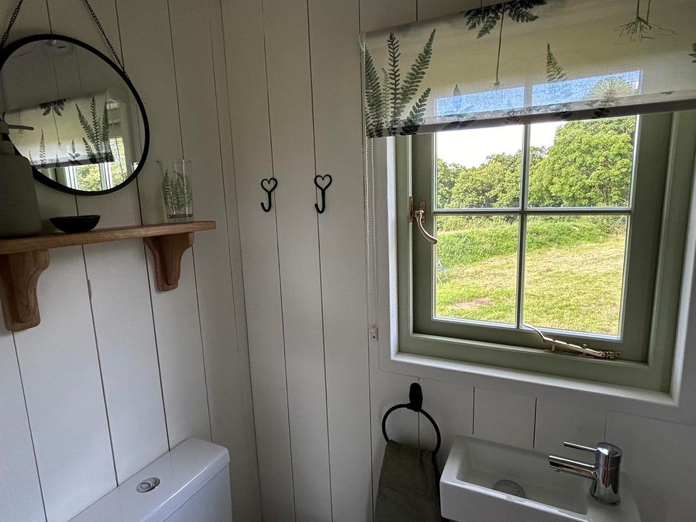 A bathroom with a toilet and sink at The Old Barn in Manchester