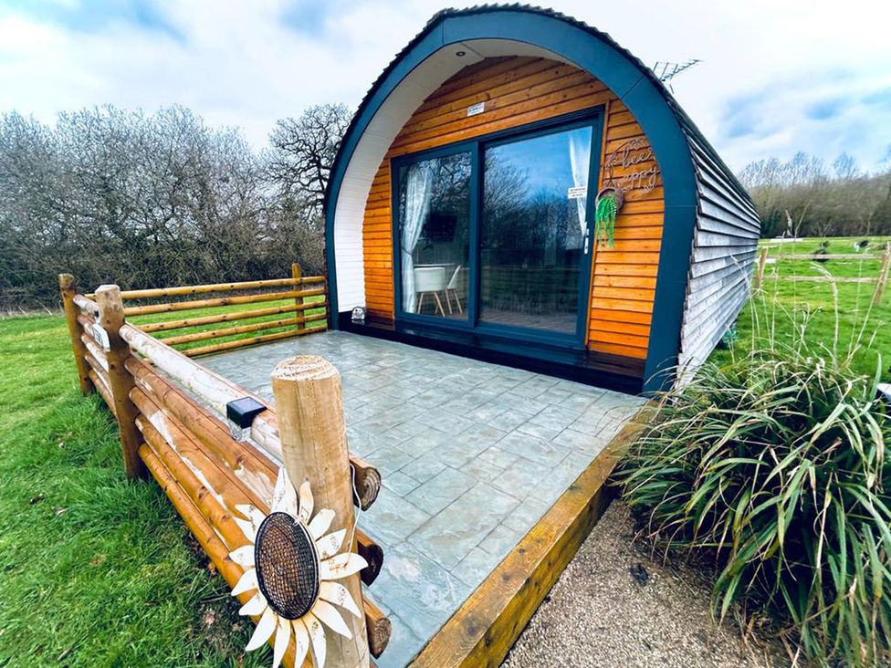 Pod cabin with a decking area at 1Bed pod cabin in beautiful surroundings Wrexham