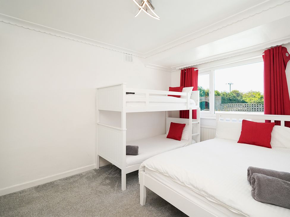 A bedroom with a bunk bed and a double bed at RentMySpaHome with Swimming Pool Hot Tub and Sauna Aughton