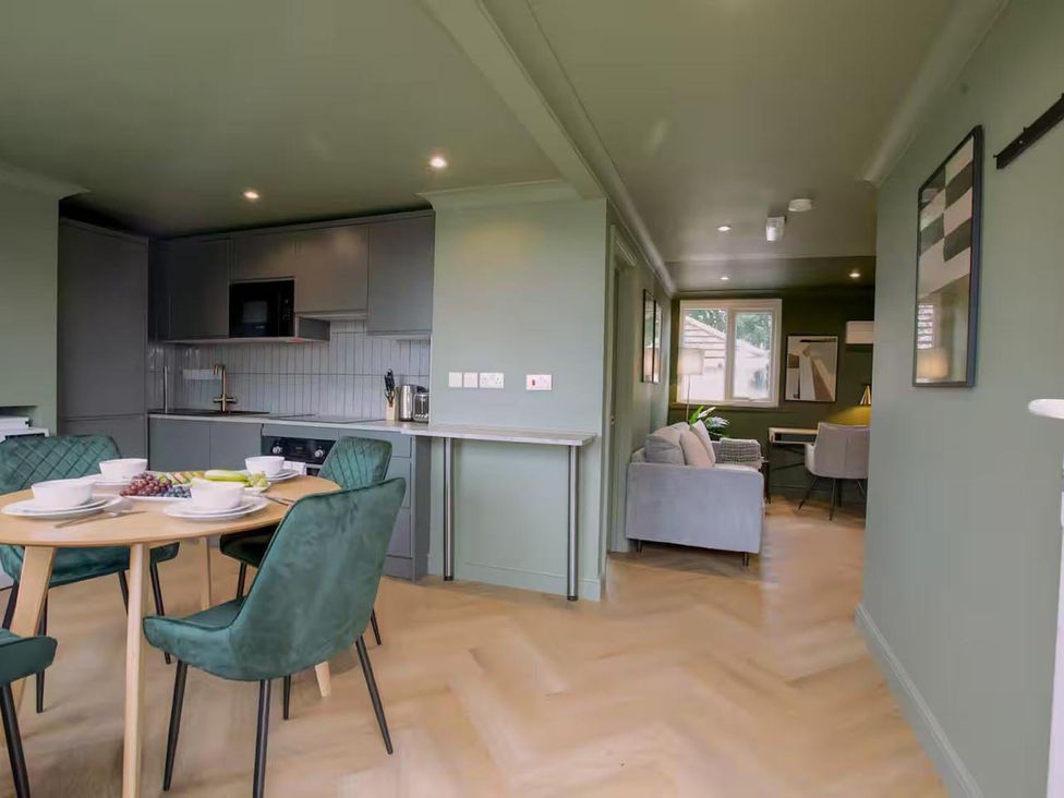 A kitchen and living area with a table and chairs at 1 Bedroom Apartment Sleeps 2 Pets Welcome in Carbis Bay