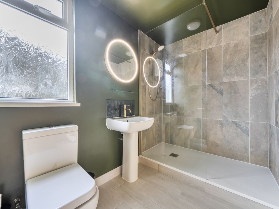A bathroom with a shower and sink at 1 Bedroom Apartment Sleeps 2 Pets Welcome in Carbis Bay