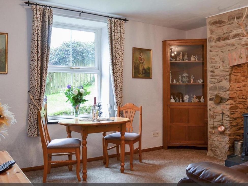 A dining area with table and chairs at the property in an unspecified location
