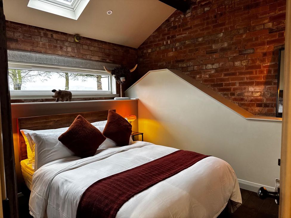 A bedroom with a bed and window at the property in 