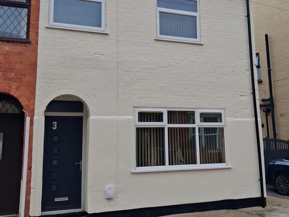 A building facade with door and windows at a residential property