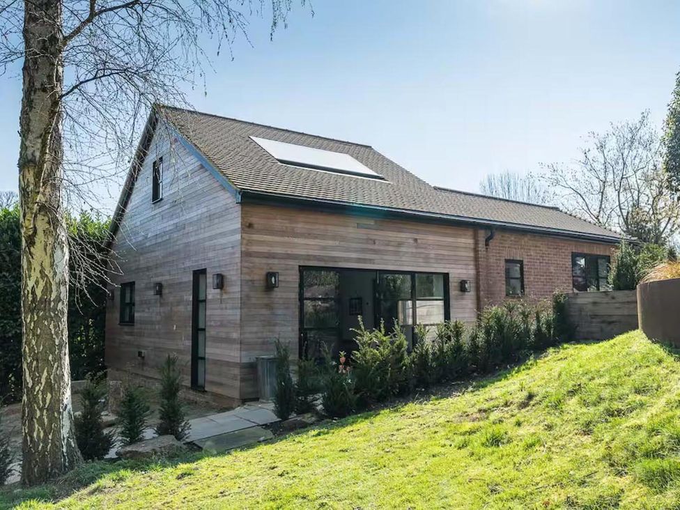 A house with a garden and pathway at the property