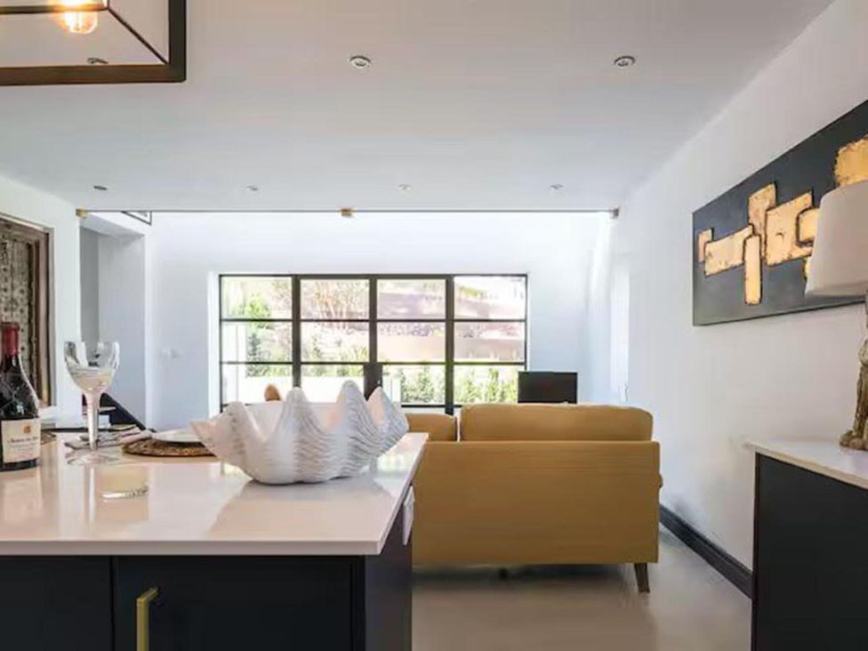 A living room with a couch and window at an unspecified property