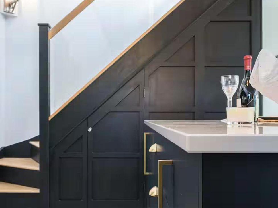 An entryway with a staircase and a countertop at the property