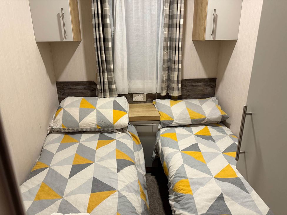 A bedroom with two single beds in Charming Caravan in beautiful Seton Sands Cockenzie And Port Seton