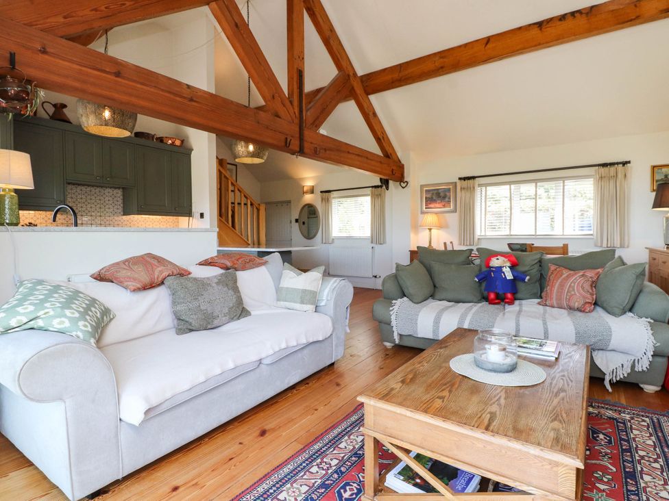 A living room with sofas and a coffee table at Hafod in Nefyn
