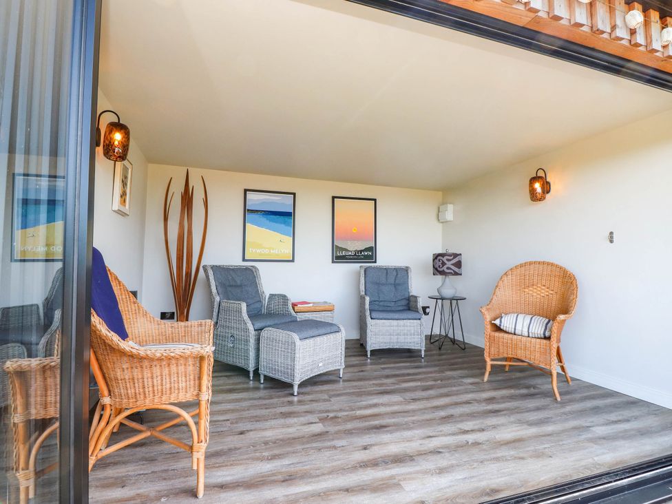 A snug with seating and artwork at Hafod in Nefyn
