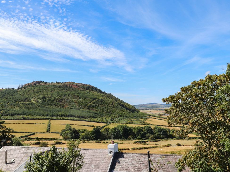 A view of fields and mountains at Hafod in Nefyn