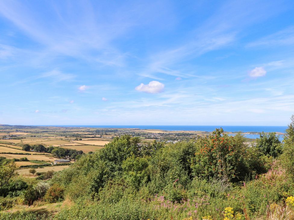 A landscape view featuring fields and ocean at Hafod in Nefyn