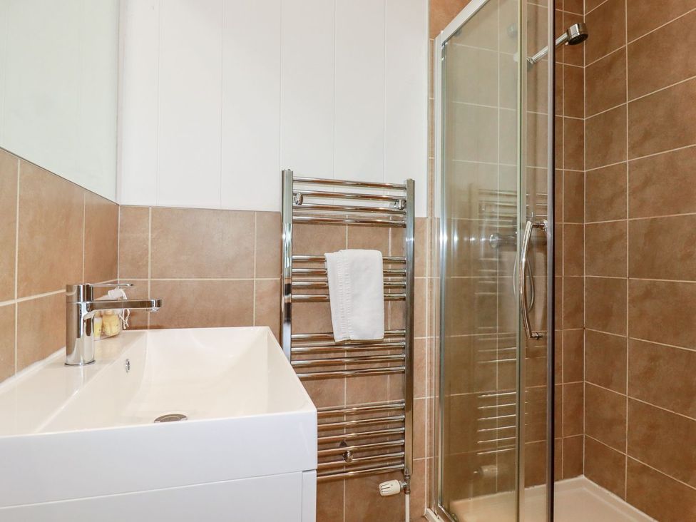A bathroom with a sink and shower at 4 Tree Tops in Liskeard