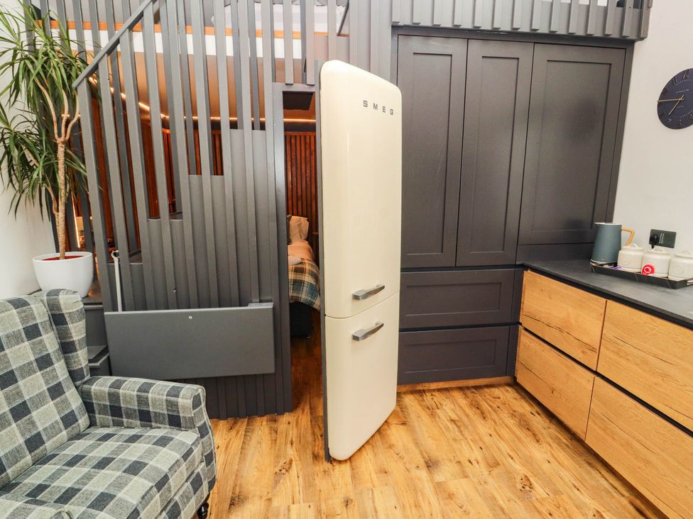A kitchen with a refrigerator and kitchen cabinets at Fourways