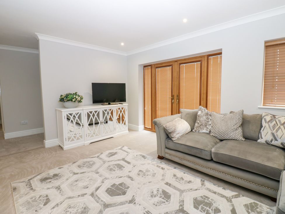 A living room with a sofa and television at Black Banks Farm Cottage Darlington