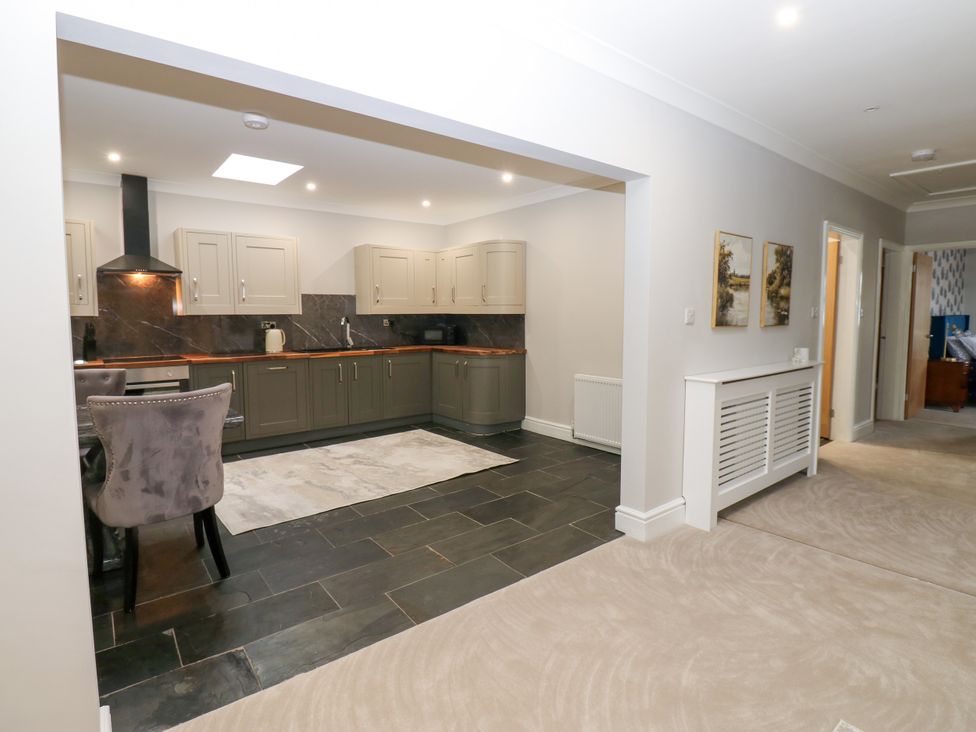 A kitchen with cabinets and a stove at Black Banks Farm Cottage, Darlington
