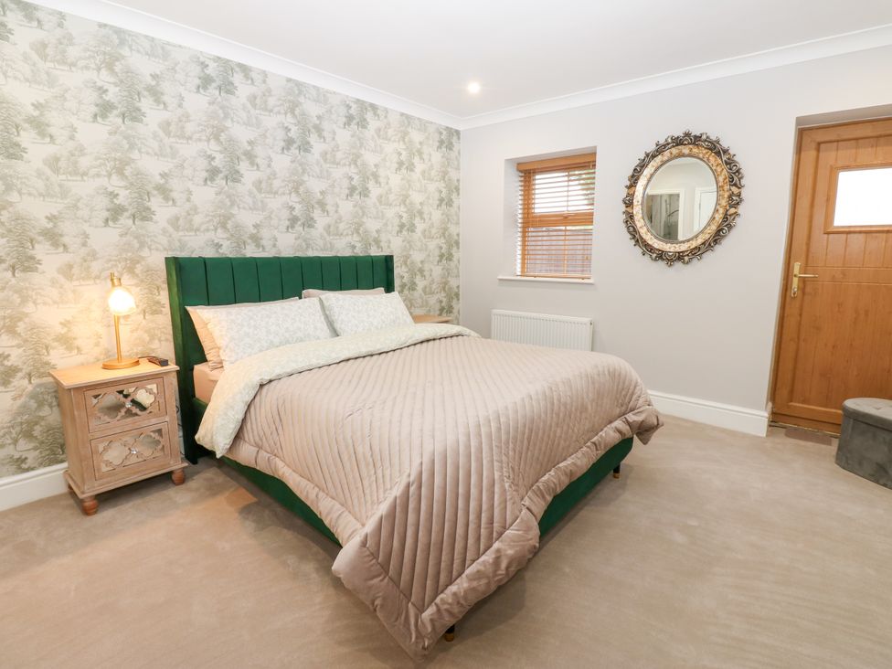 A bedroom with a bed and bedside table at Black Banks Farm Cottage Darlington