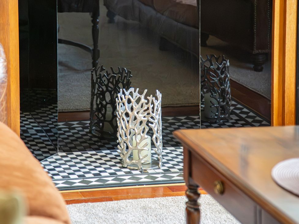 A living room with a candle holder and a coffee table at Hudson House