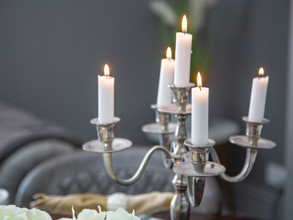 A candelabra with candles on a table at Hudson House
