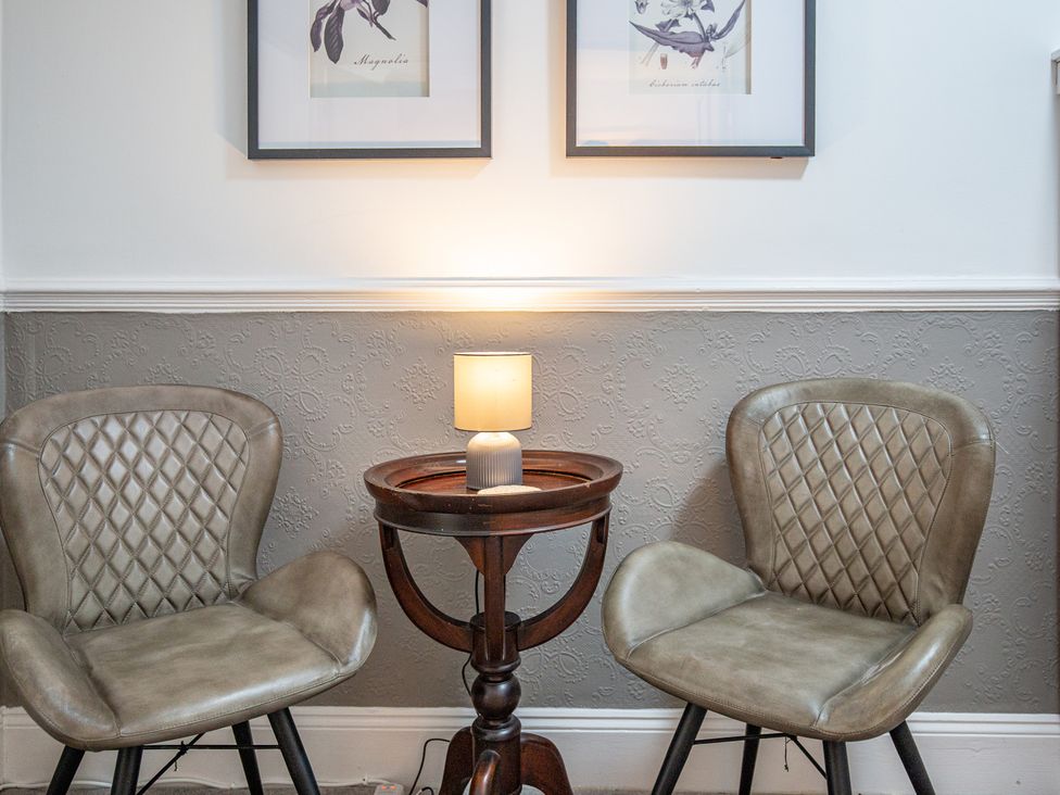 A sitting room with two chairs and a lamp at Hudson House