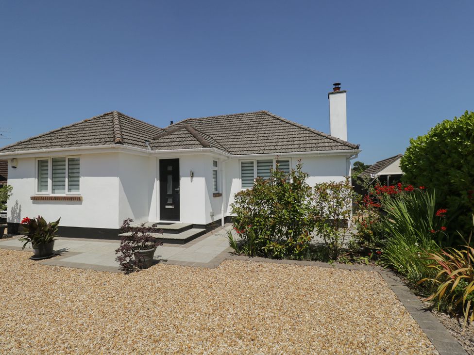 A house with a front door and garden at The Laurels in Wimborne Minster