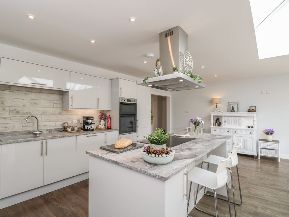 A kitchen with a countertop and appliances at The Laurels in Wimborne Minster