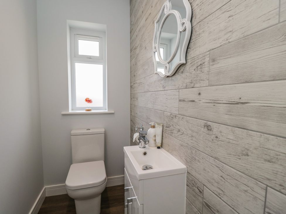 A bathroom with a toilet and sink at The Laurels in Wimborne Minster