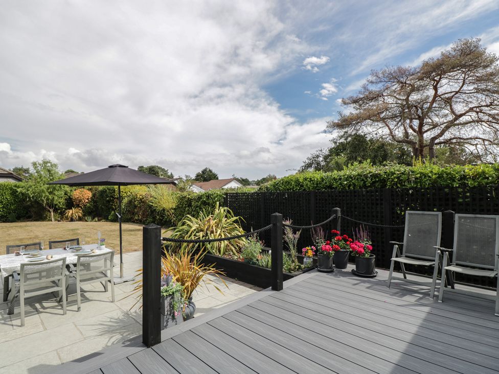 An outdoor area with a table and chairs at The Laurels in Wimborne Minster