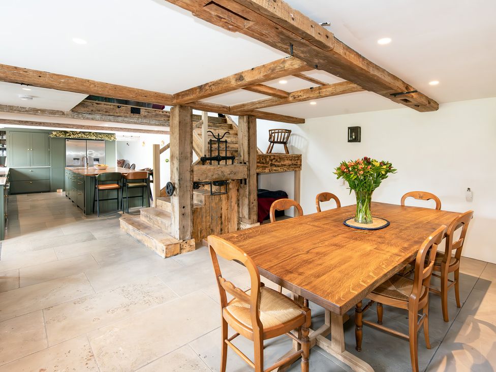 A dining room with a wooden table and chairs at French Mill in Shaftesbury