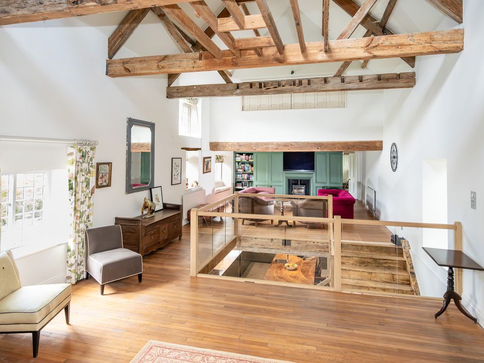 A living room with beams and furniture at French Mill in Shaftesbury