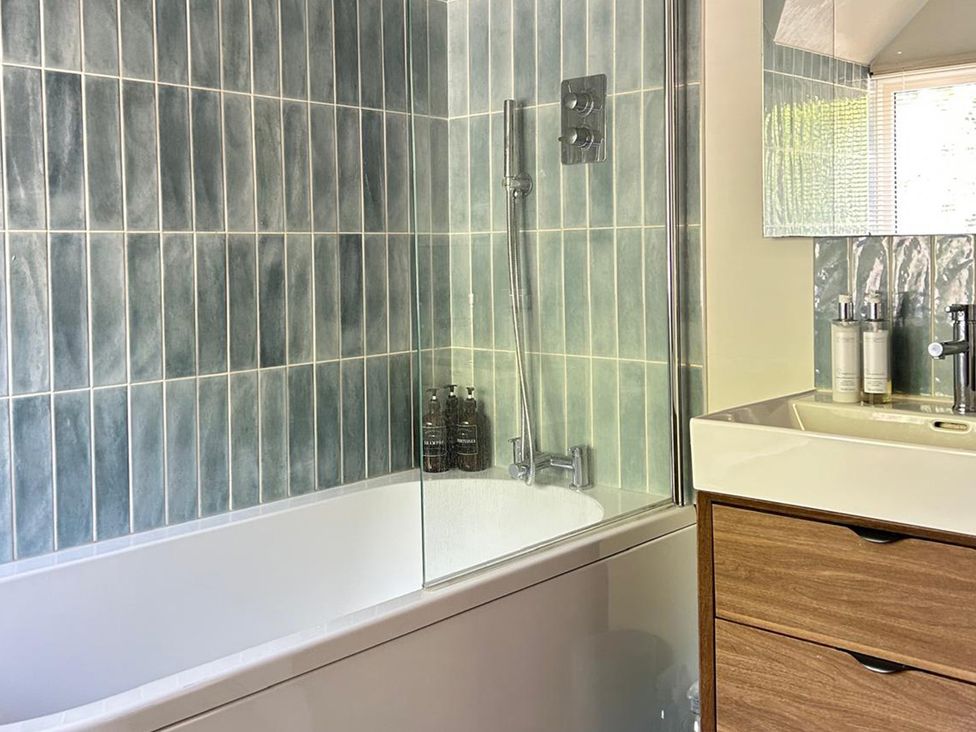 A bathroom with a bathtub and sink at French Mill, Shaftesbury