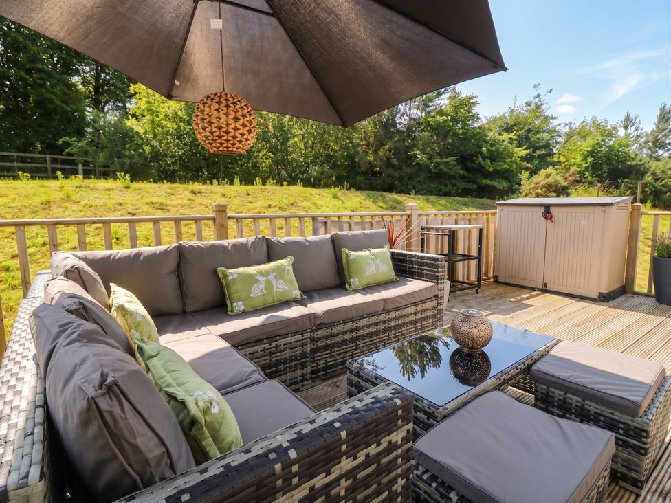 An outdoor living space with furniture at The Manor’s Retreat in Dunbar