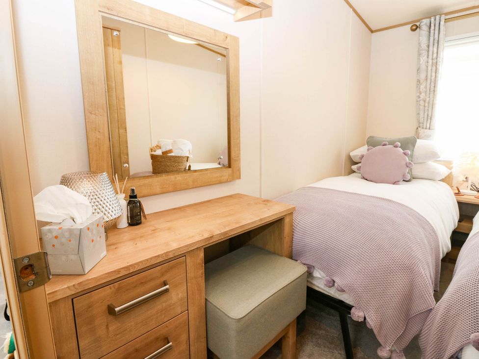 A bedroom with a desk and bed at The Manor’s Retreat in Dunbar
