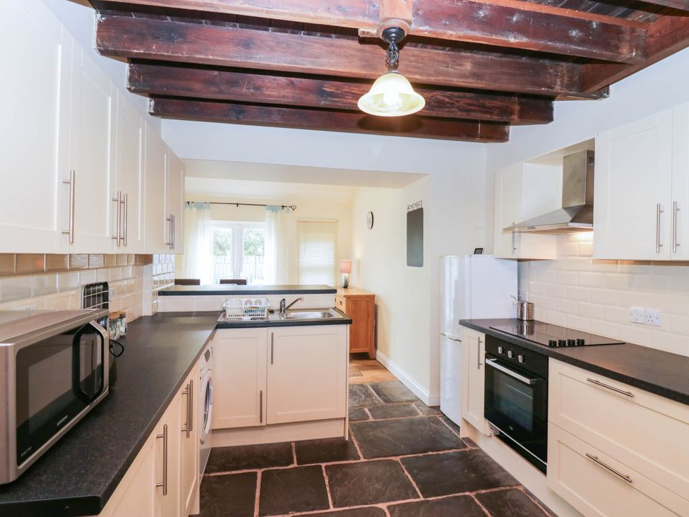 A kitchen with a refrigerator and oven at Bramble near Cleator Moor