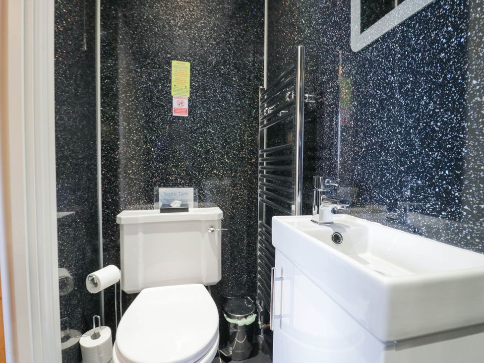 A bathroom with toilet and sink at Bramble near Cleator Moor