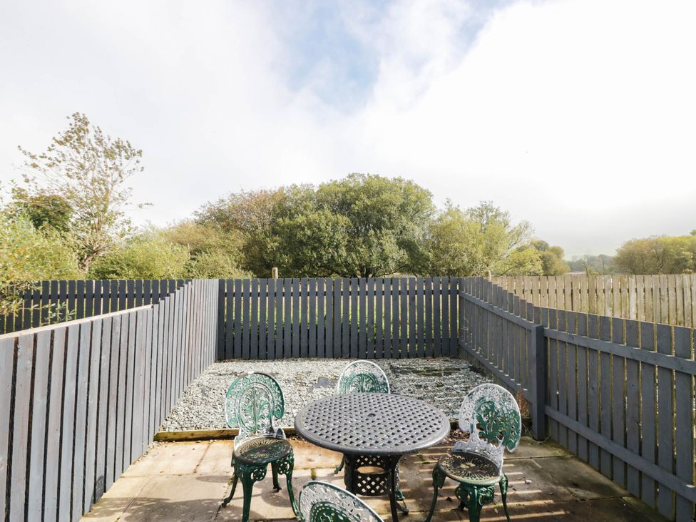A garden area with a table and chairs at Bramble near Cleator Moor