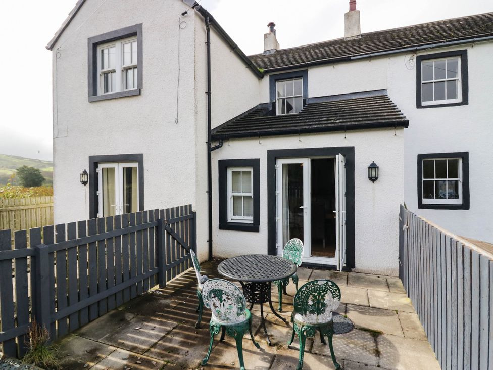 An outdoor area with a table and chairs at Bramble near Cleator Moor