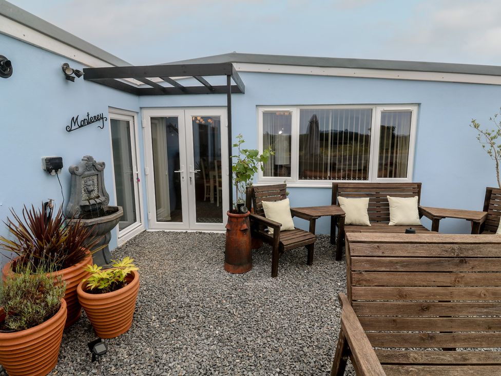 An outdoor area with seating and a fountain at The Hideaway at Monterey Helston