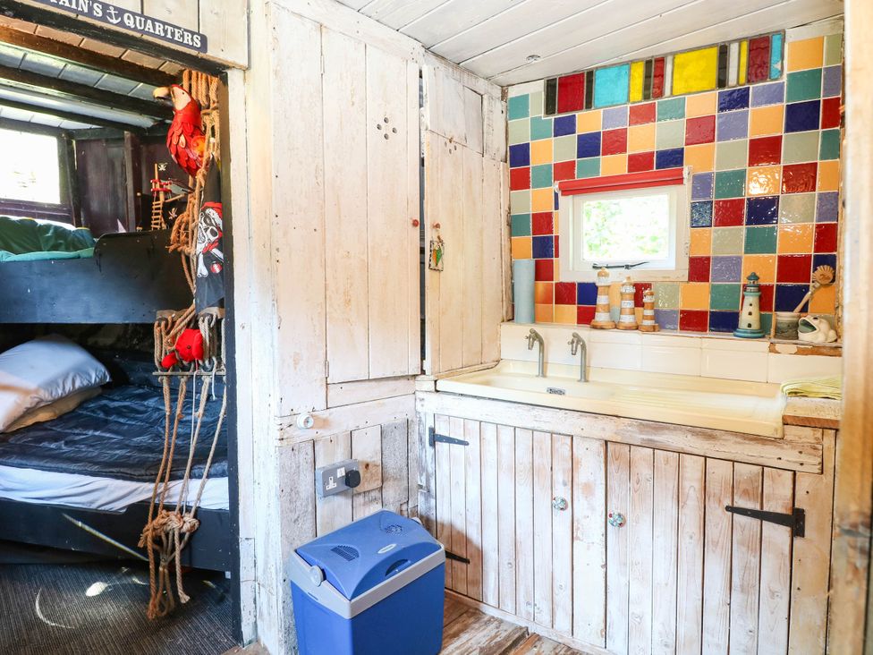 A bathroom with a sink and bunk bed at Ladies of Bolton in Horsford