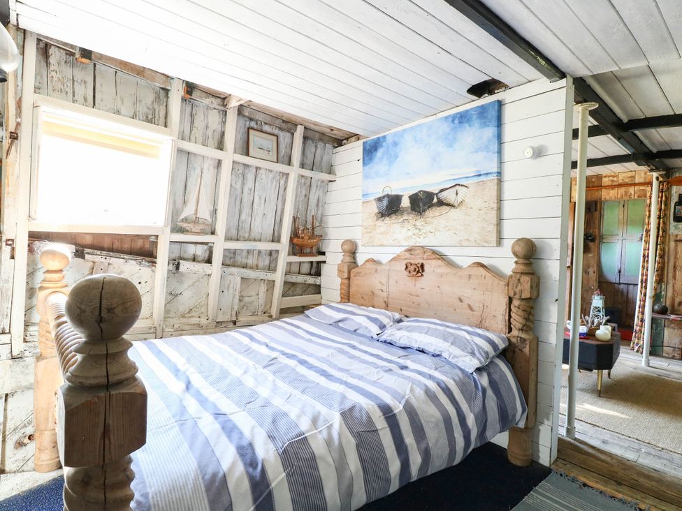 A bedroom with a bed and a window at Ladies of Bolton in Horsford