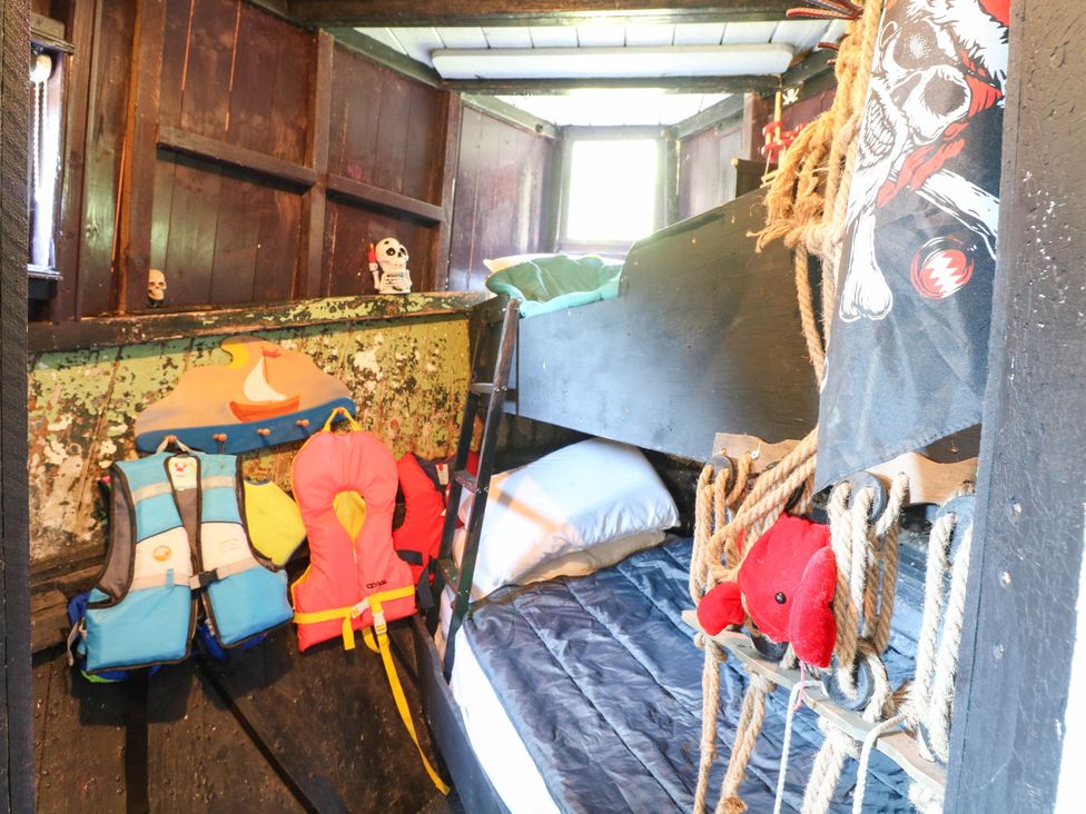 A bedroom with bunk beds and life jackets at Ladies of Bolton in Horsford