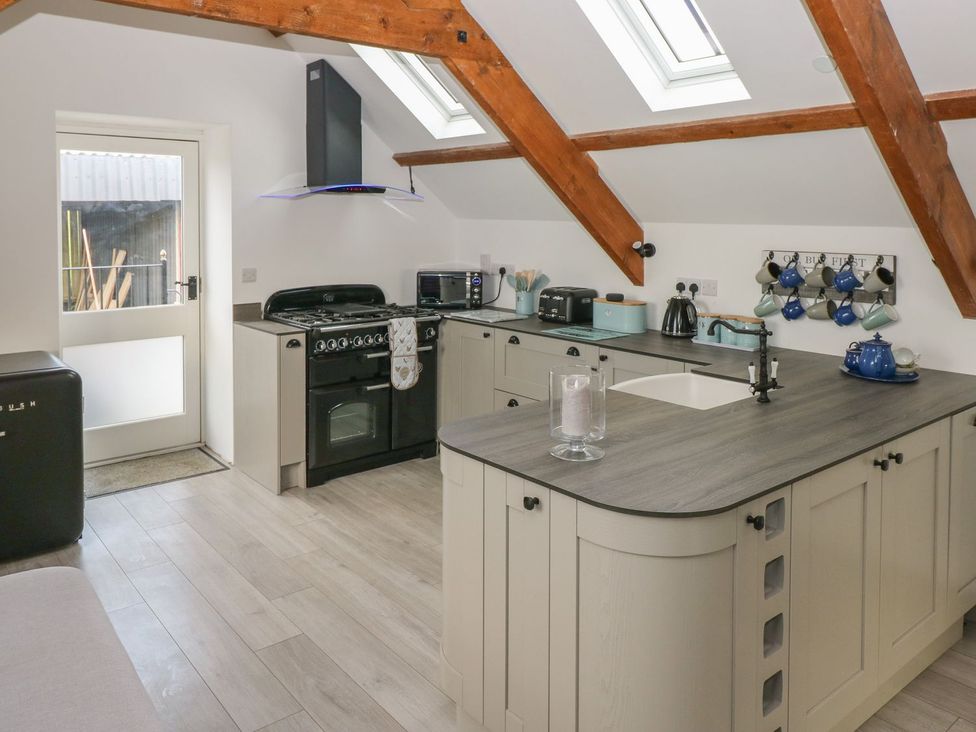A kitchen with appliances and countertop at The Cartbarn at Cadwgan Farm near Whitland