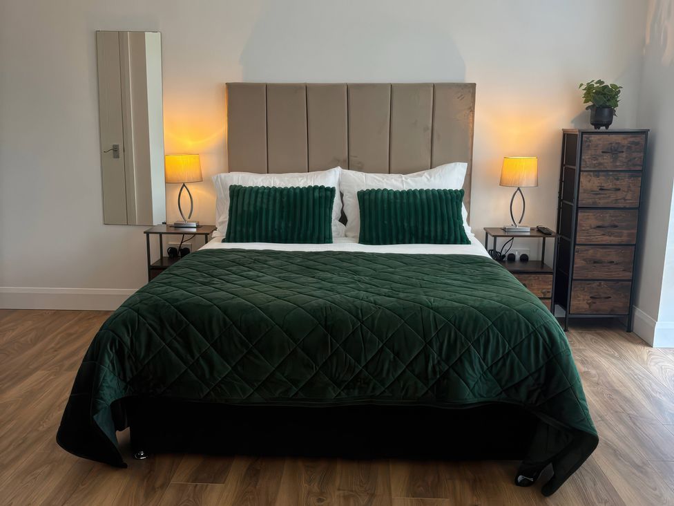 A bedroom with a bed and bedside tables at Truly Scrumptious in Yarm
