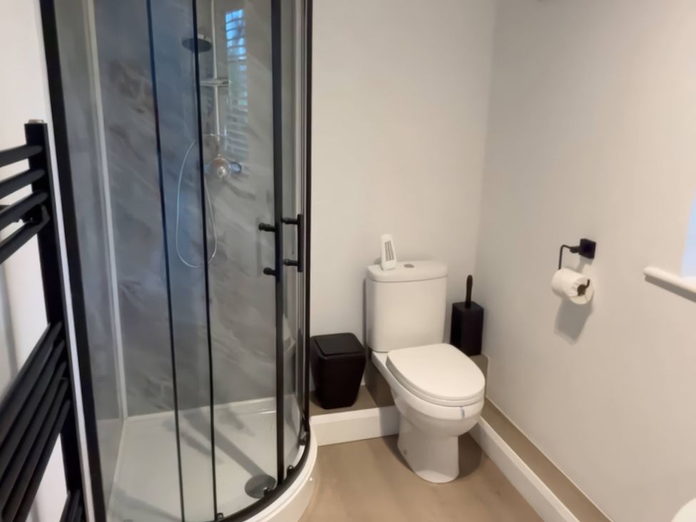 A bathroom with a shower and toilet at Truly Scrumptious in Yarm