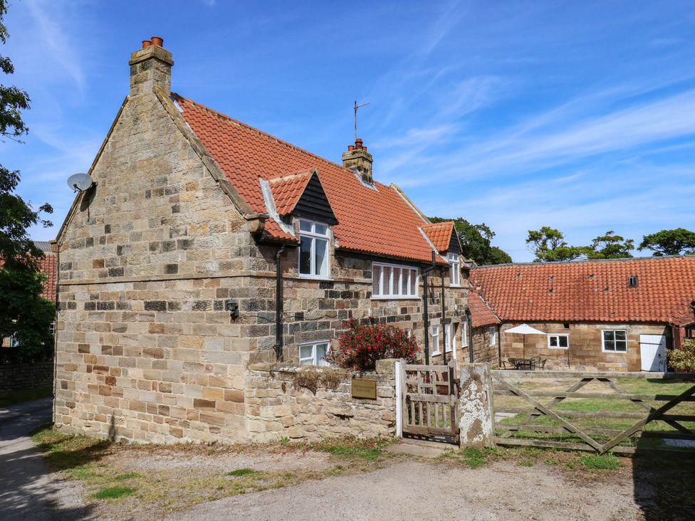 A house with a garden and gate at Farmhouse in Whitby